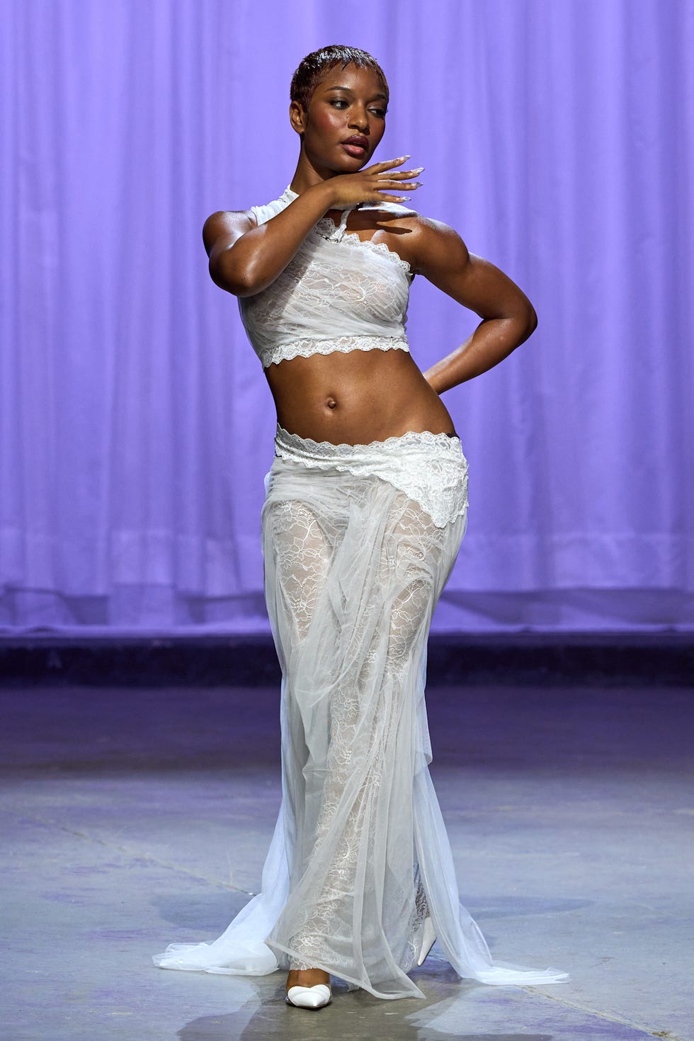 performance art showcasing a dancer in a lace outfit
