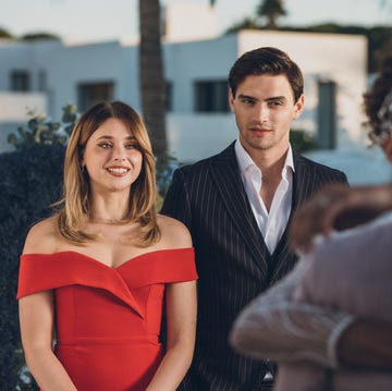 Culpa Nuestra wedding ceremony with a couple in formal attire and guests