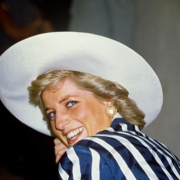 princess diana in blue stripe suit and white wide brimmed hat