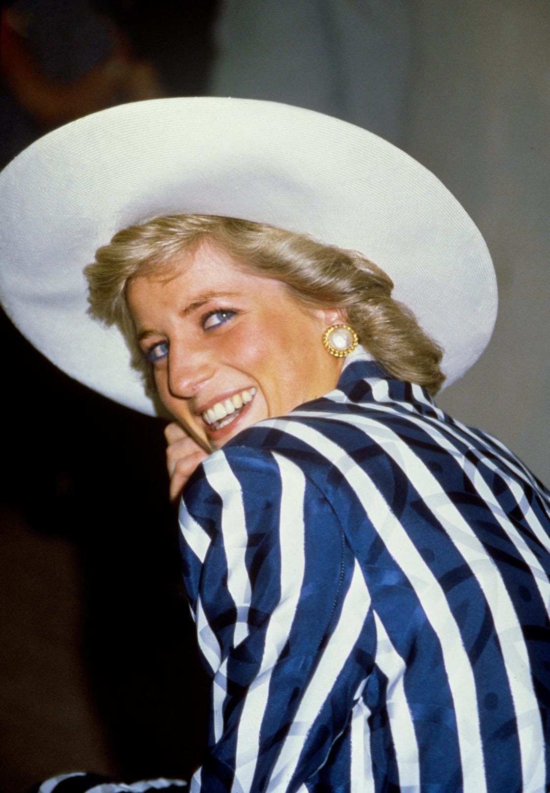 princess diana in blue stripe suit and white wide brimmed hat