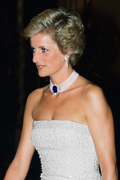 hungary   may 07  princess diana wearing a white strapless dress, embroidered with pearls, designed by catherine walker for a banquet during her official visit to hungary, a pearl and sapphire choker completes the look  photo by tim graham photo library via getty images