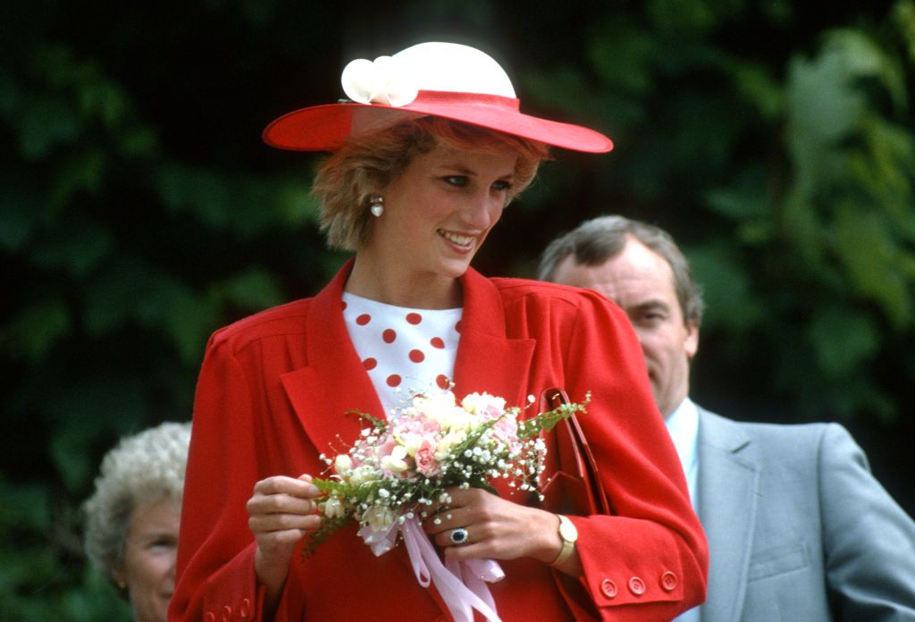 diana princess of wales wearing a red jacket designed by news photo