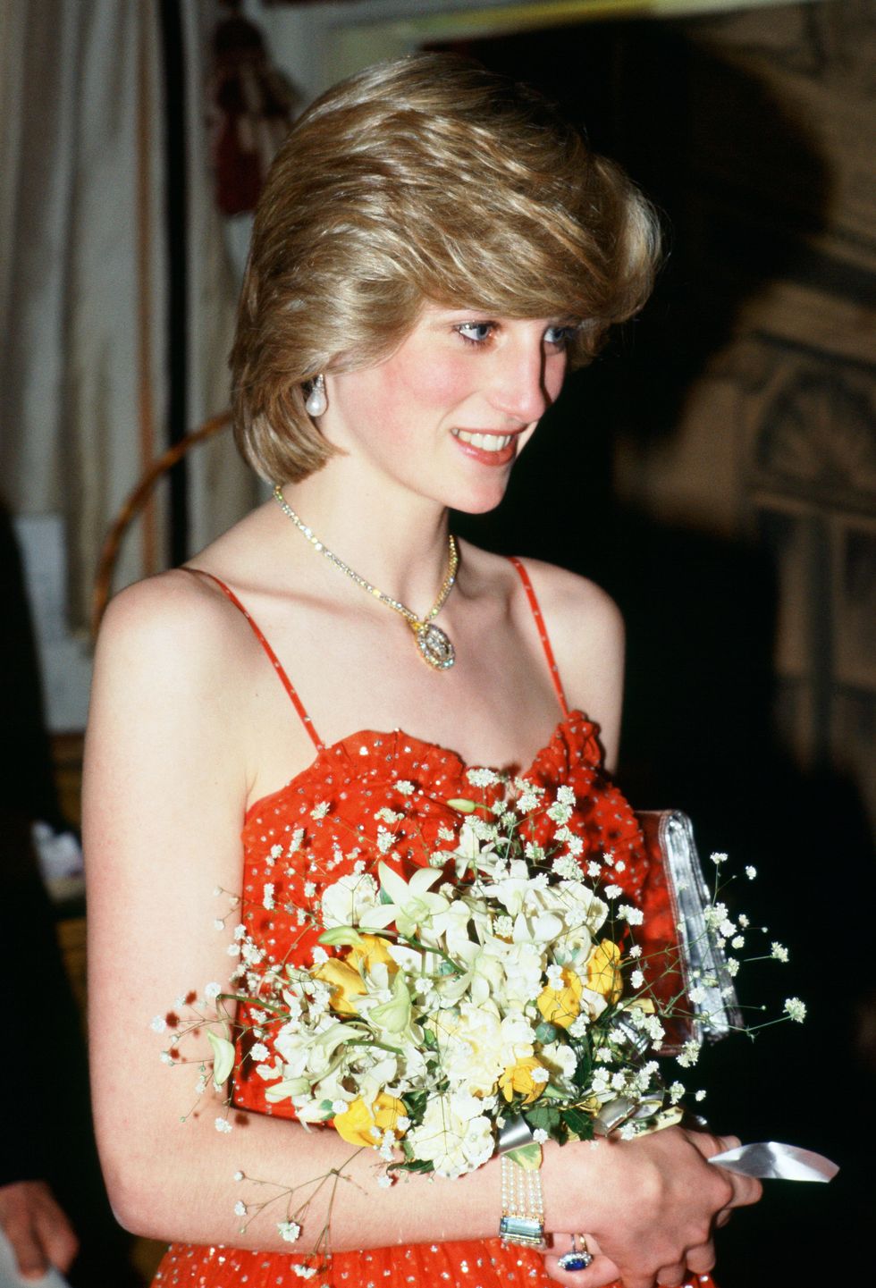 diana, princess of wales wears a gold and diamond necklace i