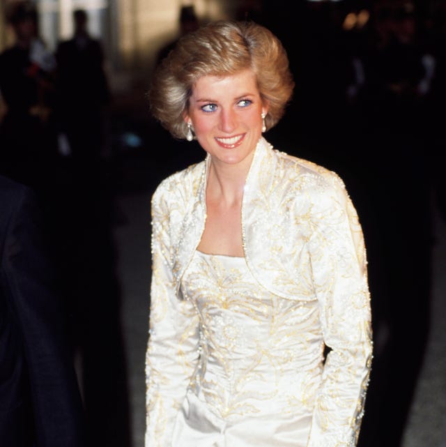 Diana, Princess of Wales wears a white beaded dress and bole