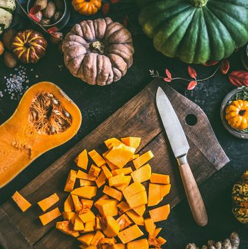 diced ​​pumpkin on cutting board with knife