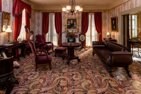the victorian style parlor of the homestead, as it appears in apple tv's "dickinson"