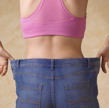 dieting woman in jeans too large