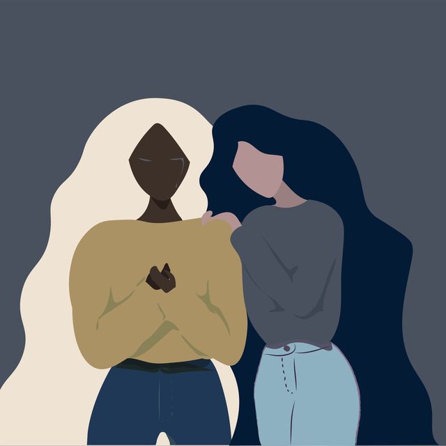 different ethnicity girl friends long hair helping each other when one of them is crying on a grey  blue background