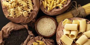 different types of dry pasta and rice in recycling bags