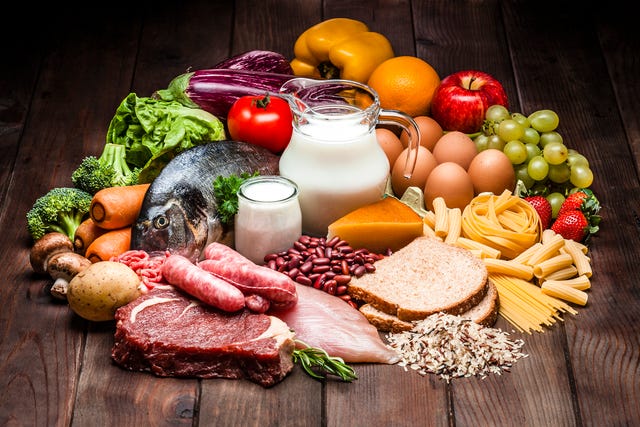 Different types of food on rustic wooden table