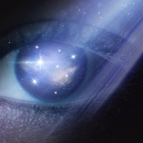 digital composite image of universe in eye