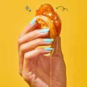 a hand holding a chicken nugget between two eggo waffles a hand holding a chicken nugget between two eggo waffles