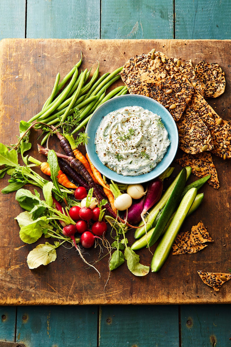 dill dip with vegetables and crackers