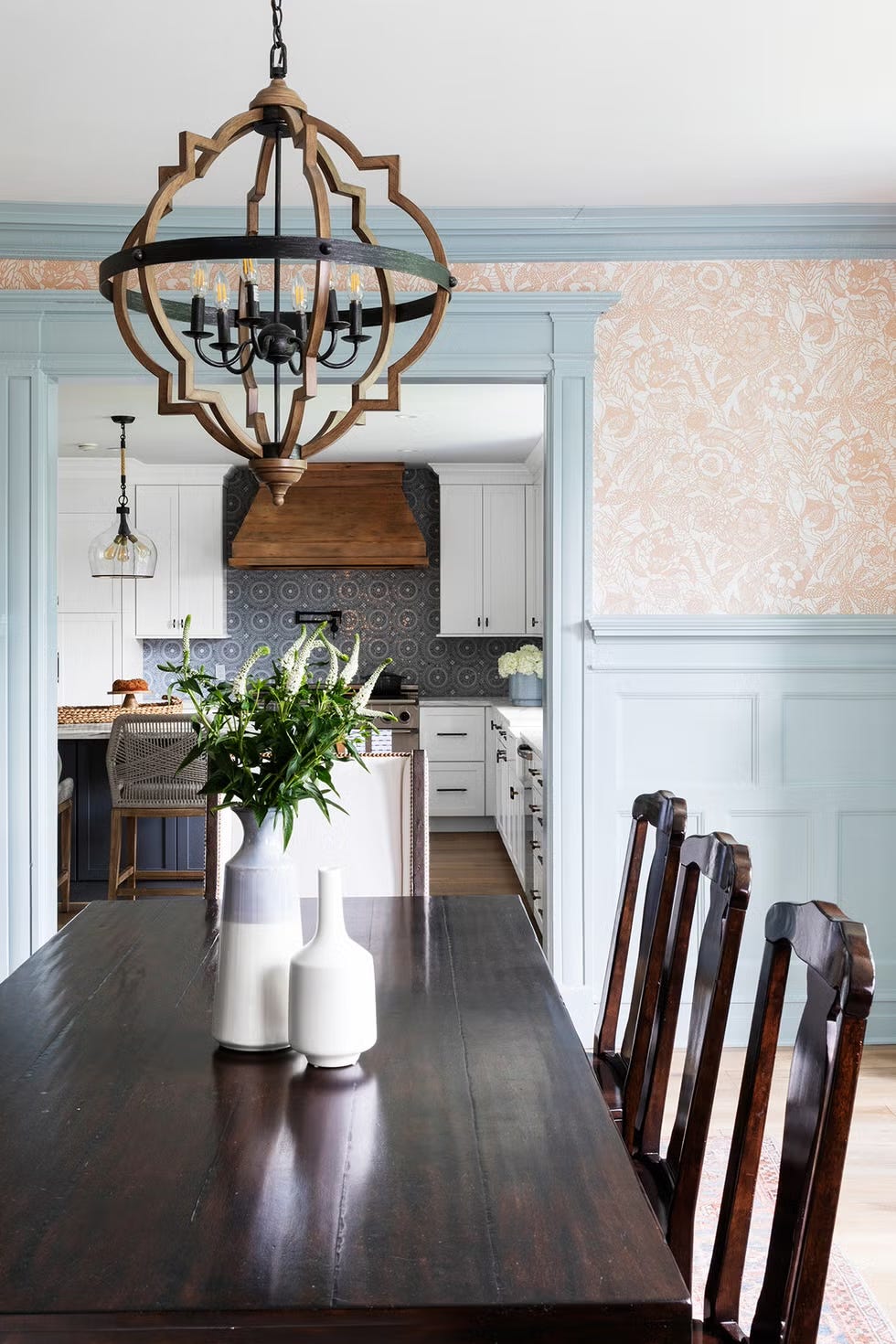 dining room with blue paneling