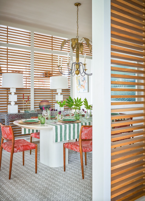 coastal dining room with a wood slatted screen