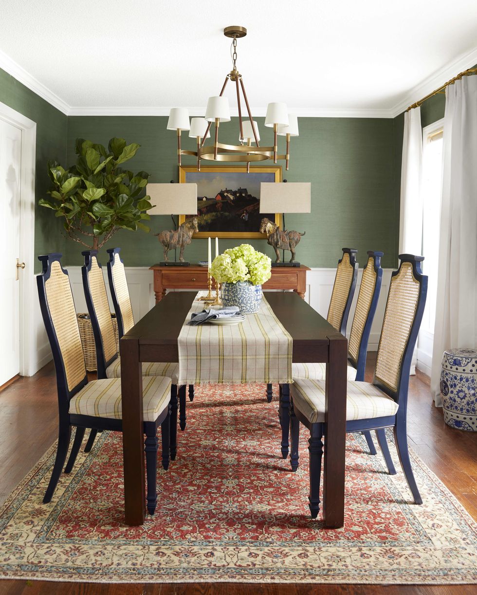 preppy dining room with green wallpaper