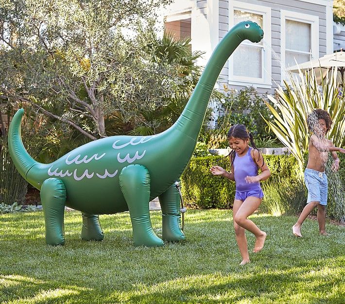 Dinosaur, Green, Inflatable, Public space, Games, Leaf, Botany, Grass, Recreation, Garden, 