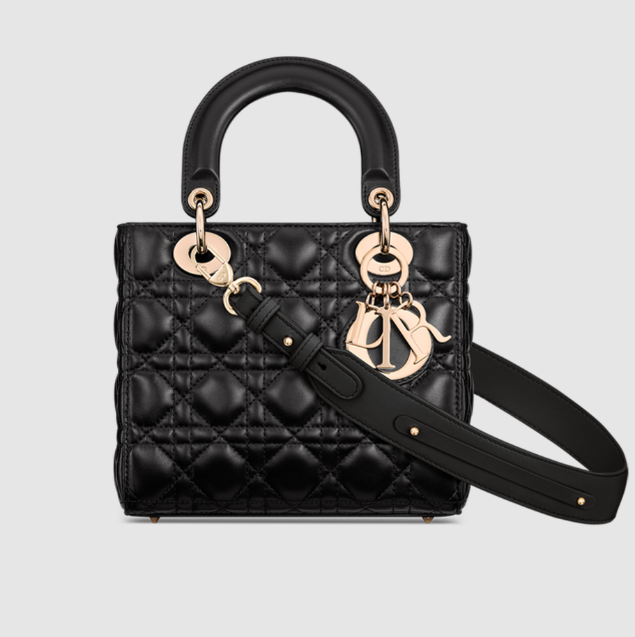 a black handbag with a black strap