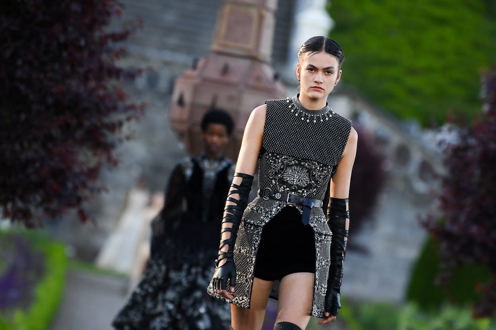 a model presents a creation for dior during the 2025 dior croisiere cruise fashion show on june 3, 2024 at drummond castle, in crieff, in scotland photo by andy buchanan  afp photo by andy buchananafp via getty images