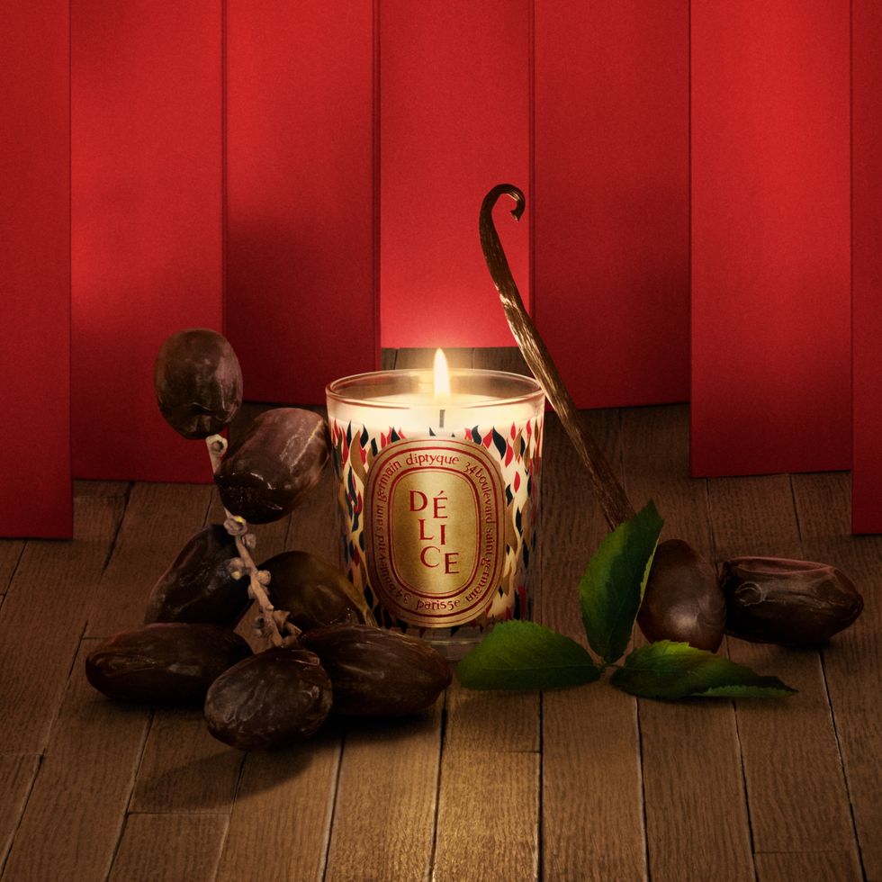 a candle and some snail shells