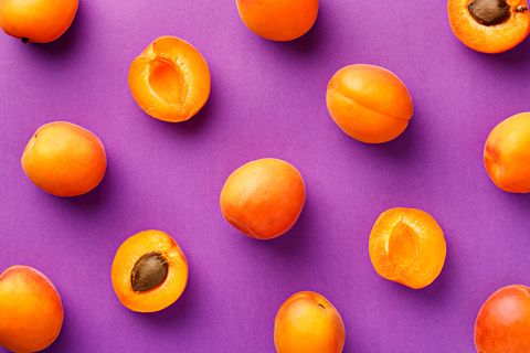 Directly Above Shot Of Apricots On Purple Background