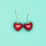 Directly Above Shot Of Cherries On Turquoise Background