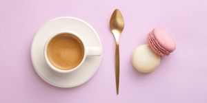 Directly Above Shot Of Colorful Macaroons Coffee On Pink Background