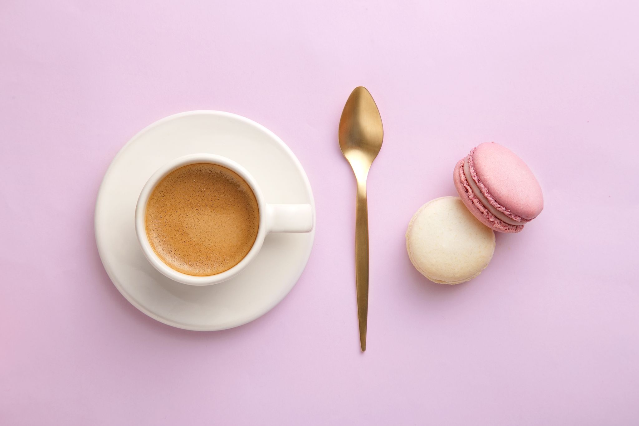 Directly Above Shot Of Colorful Macaroons Coffee On Pink Background