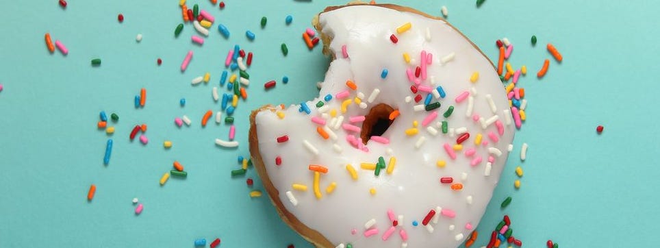 Directly Above Shot Of Donut On Blue Background Directly Above Shot Of Donut On Blue Background