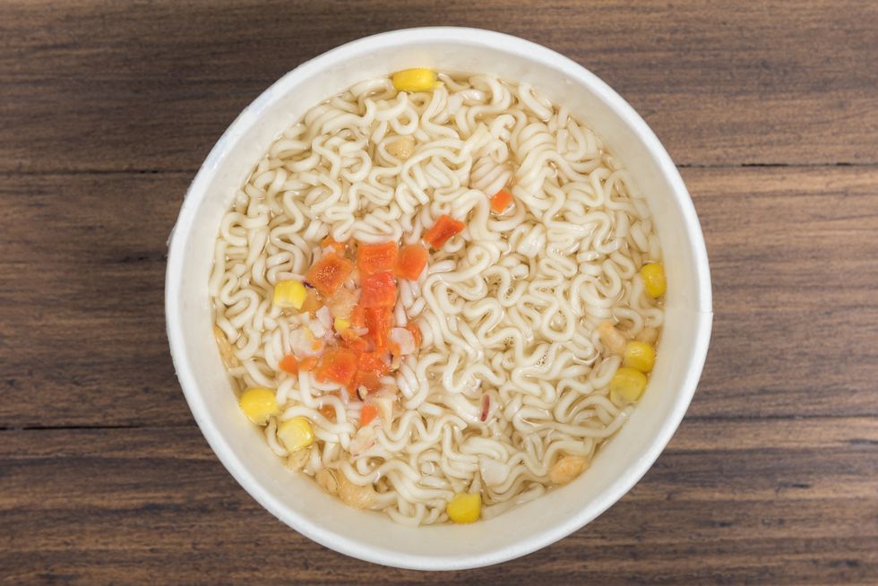directly above shot of instant noodles in cup on table