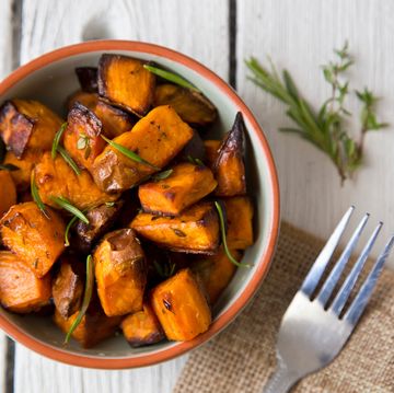 directly above shot of roasted sweet potatoes served in bowl