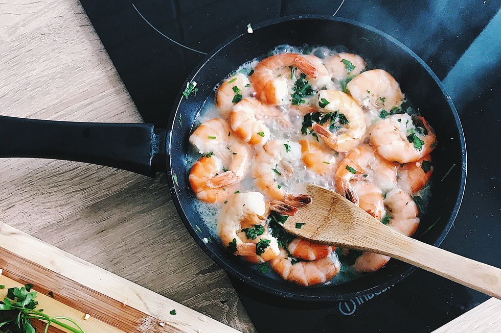 Directly Above Shot Of Shrimp In Cooking Pan On Induction