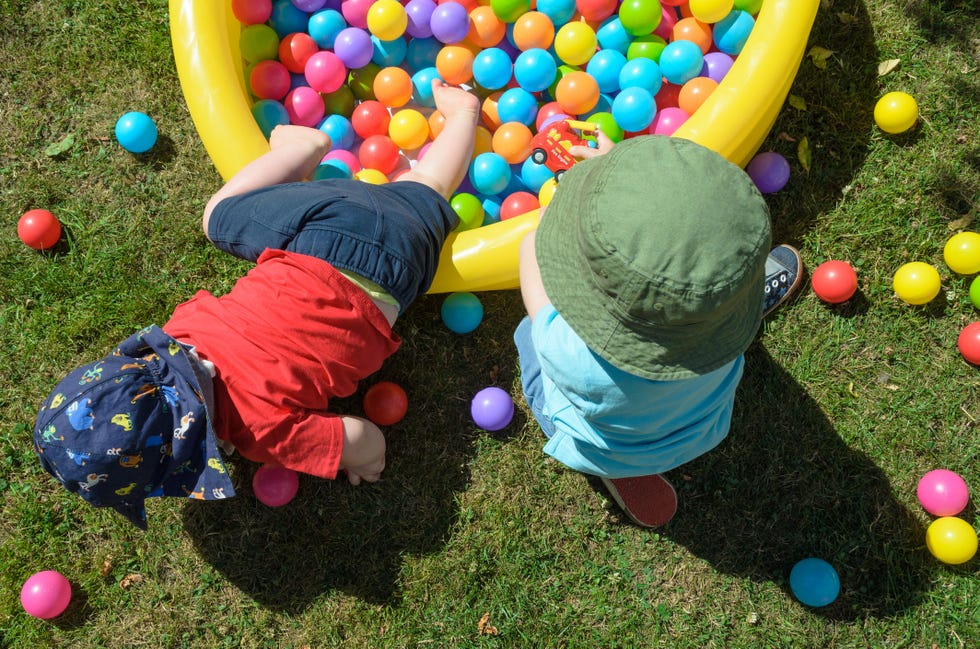 easter egg hunt ideas, children playing in a ball pit outside