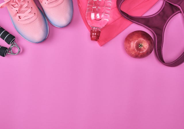 Directly Above Shot Of Sports Equipment On Pink Background