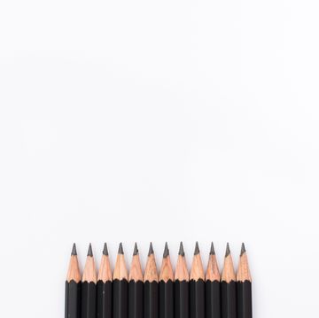 Directly Above View Of Black Pencils On White Background