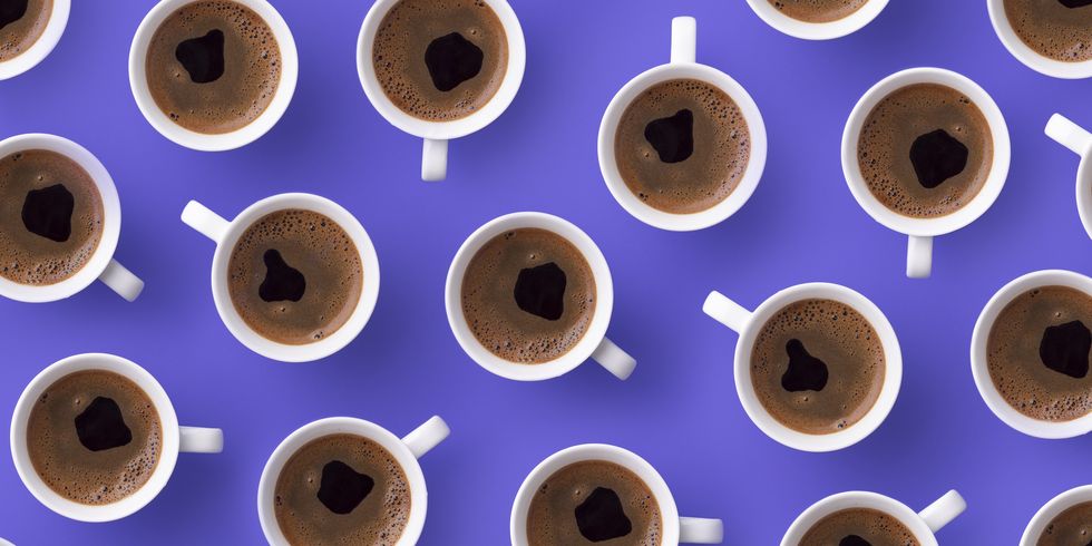 directly above view of fresh coffee in cups over purple background