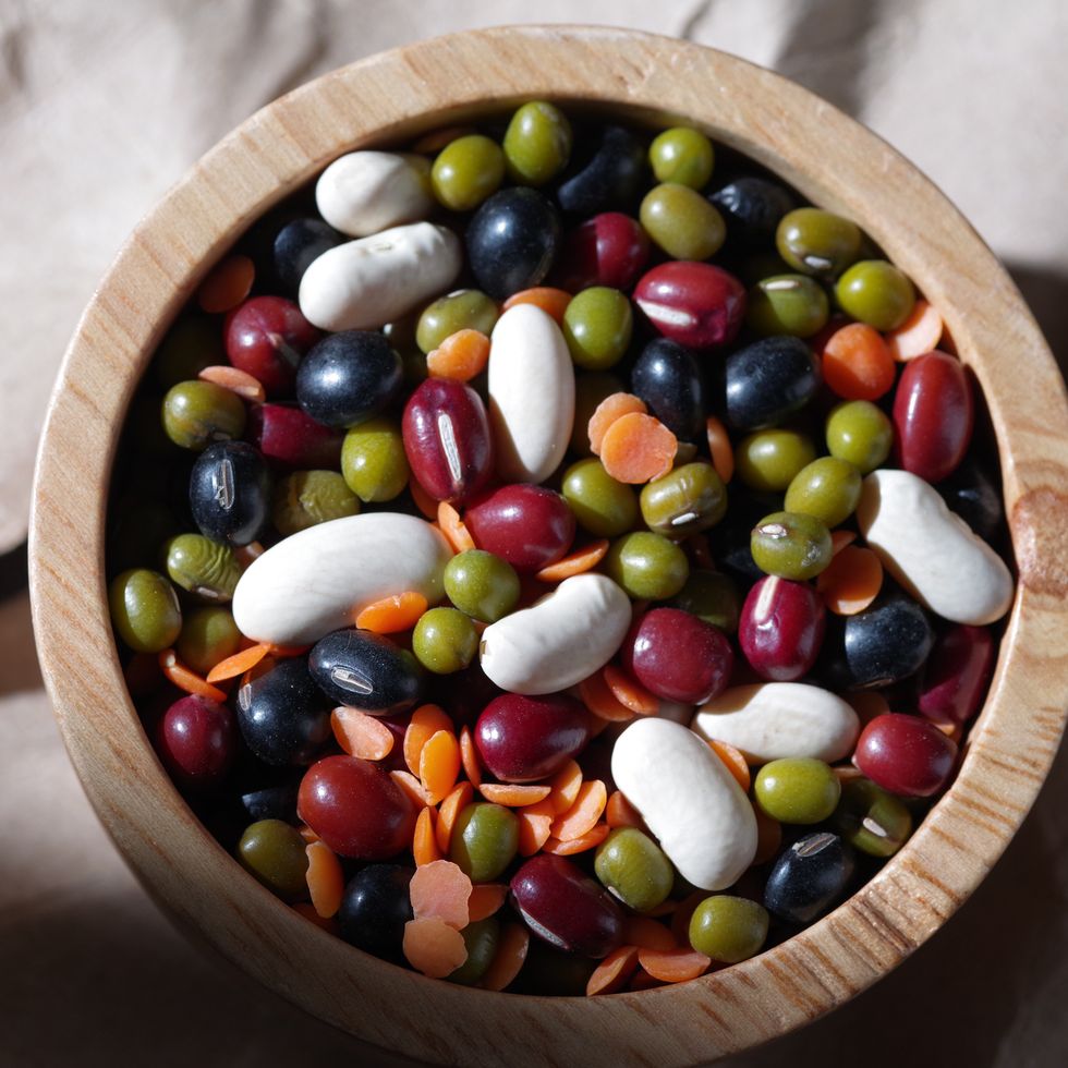 directly above view the colorful healthy mixed bean in wooden bowl