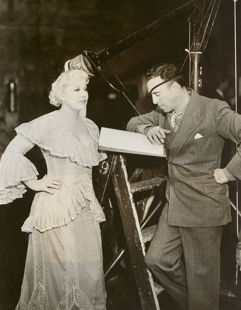 Actress Mae West with Director Raoul Walsh on Set