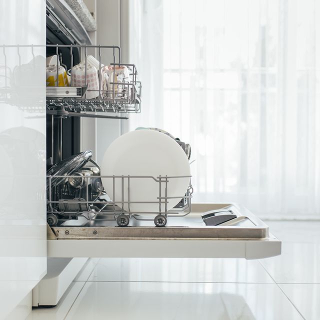 a dishwasher filled with plates and glassware