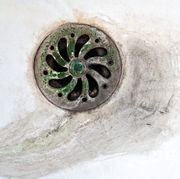 dirty stained sink plug of toilet