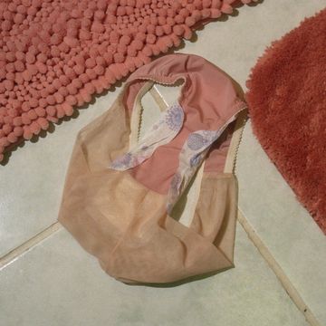 Underwear with Feminine Product On Floor