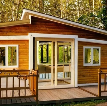 wooden cabin in a forested area wooden cabin in a forested area