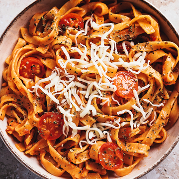 bowl of pasta with cherry tomatoes and cheese bowl of pasta with cherry tomatoes and cheese