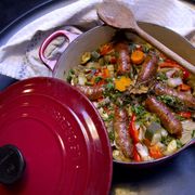 le creuset cast iron dish with a sausage casserole in