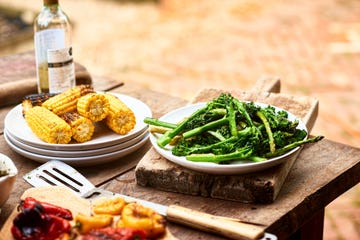 dishes with freshly prepared green vegetables and sweetcorn