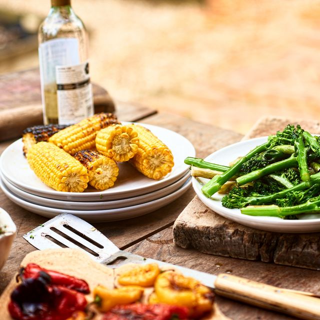 dishes with freshly prepared green vegetables and sweetcorn