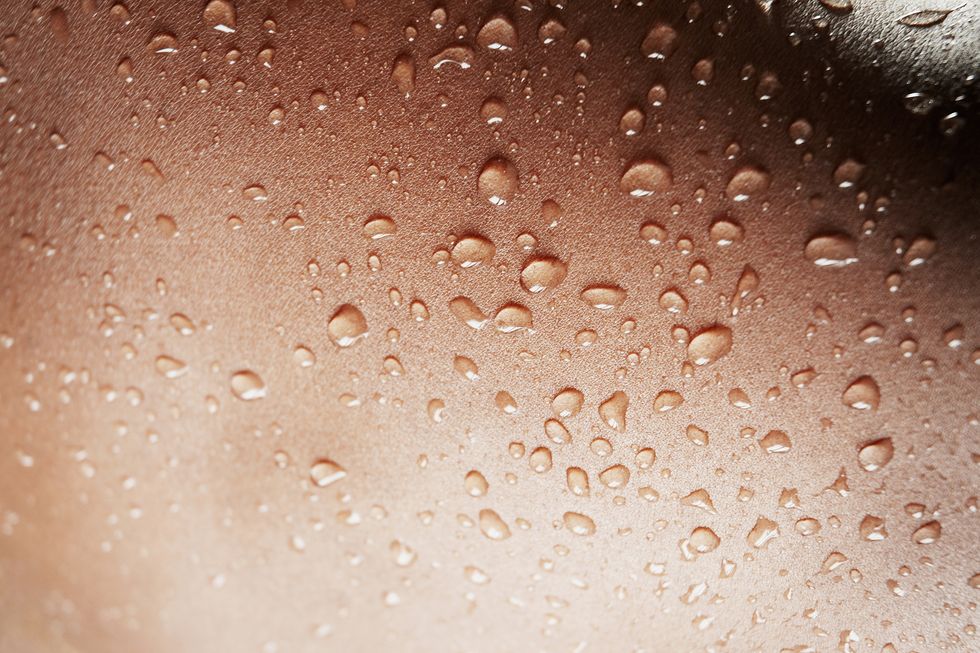 a close up of a surface with water drops on it