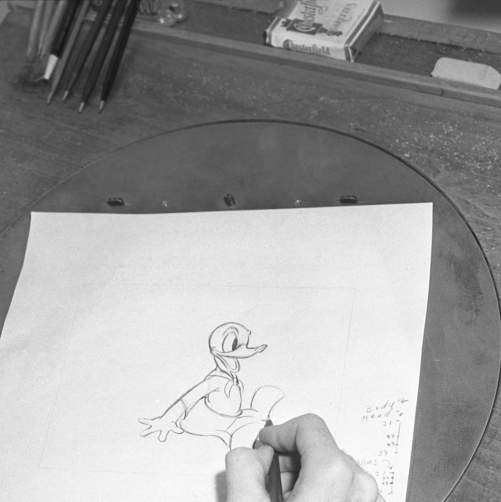 donald duck being drawn by an animator