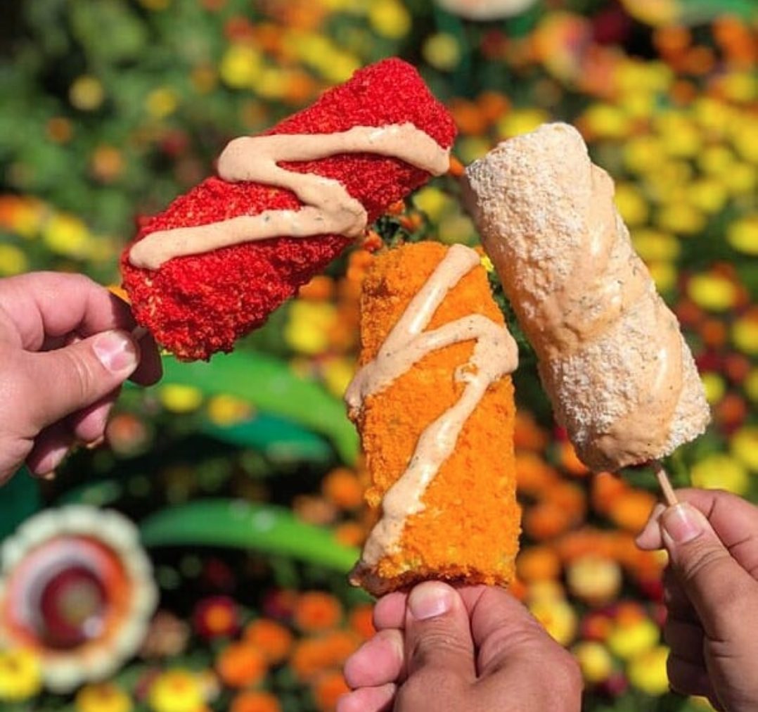 Disneyland Is Now Selling Corn On The Cob Smothered In Spicy Cheese Puffs