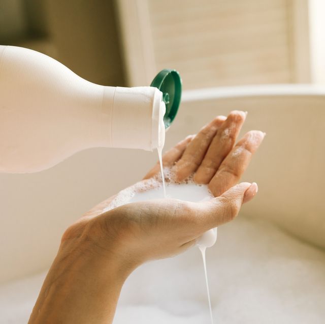 dispenser with white liquid soap or shower gel, for intimate hygiene.